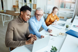 Business team working on laptop